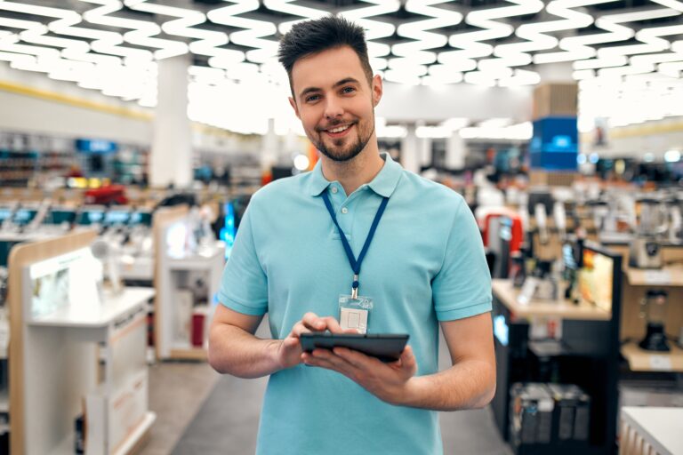 A sales representative in an appliance and gadget store.