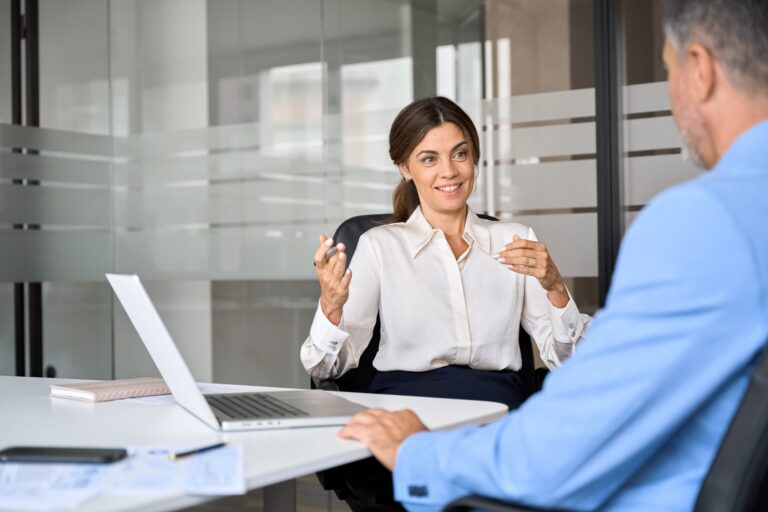 A business professional demonstrating confidence while speaking to a client.